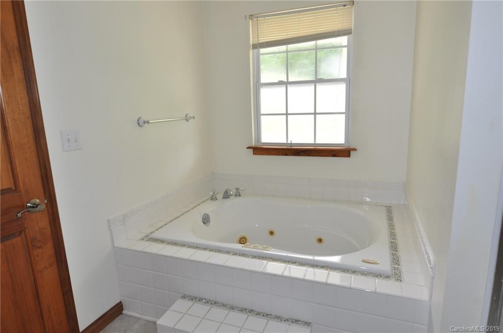 1081 West End Road Chester, SC 29706 - Photo 8 of 22 a white bath tub sitting next to a window