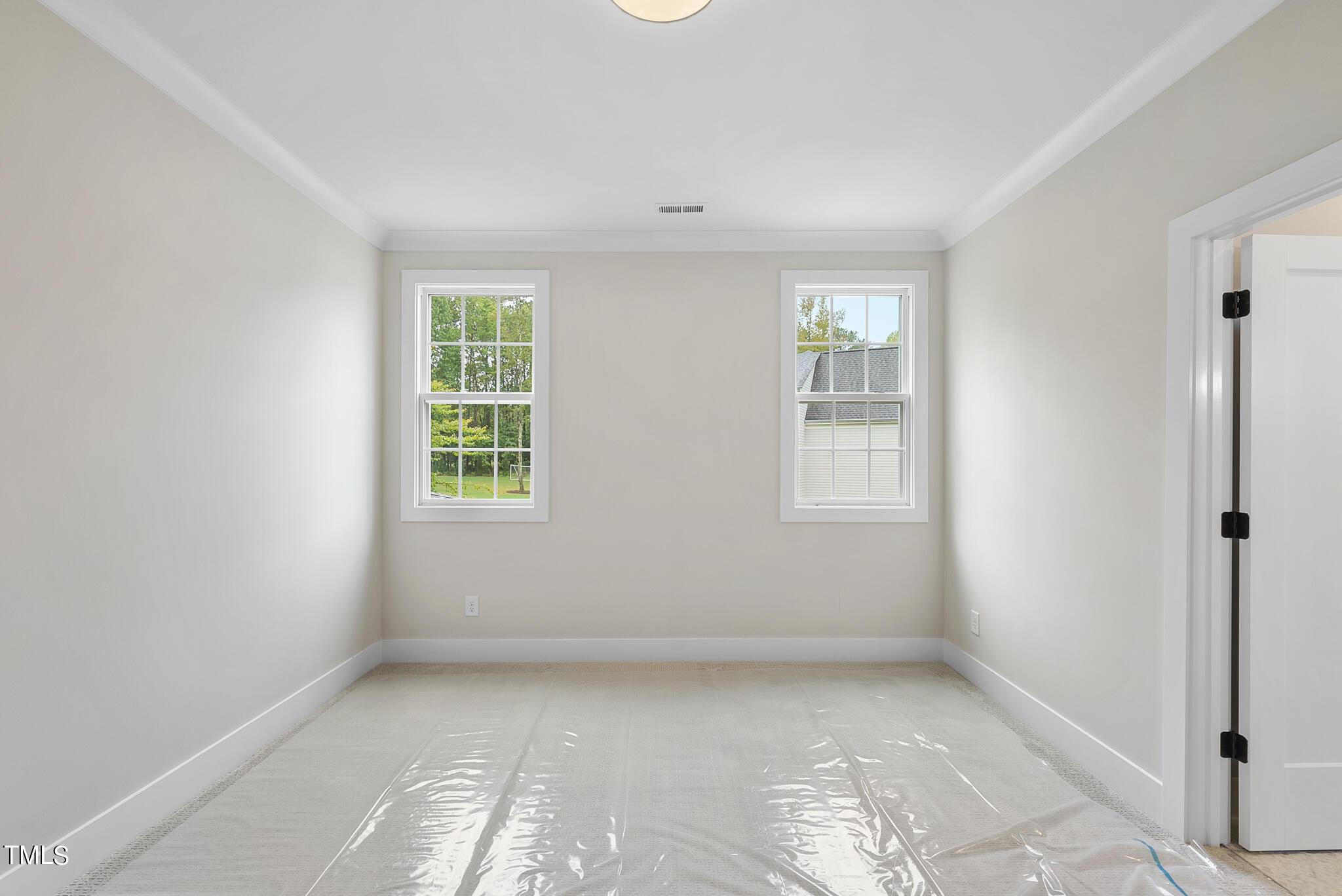 1409 Starry Night Court Raleigh, NC 27613 - Photo 29 of 35 an empty room with windows