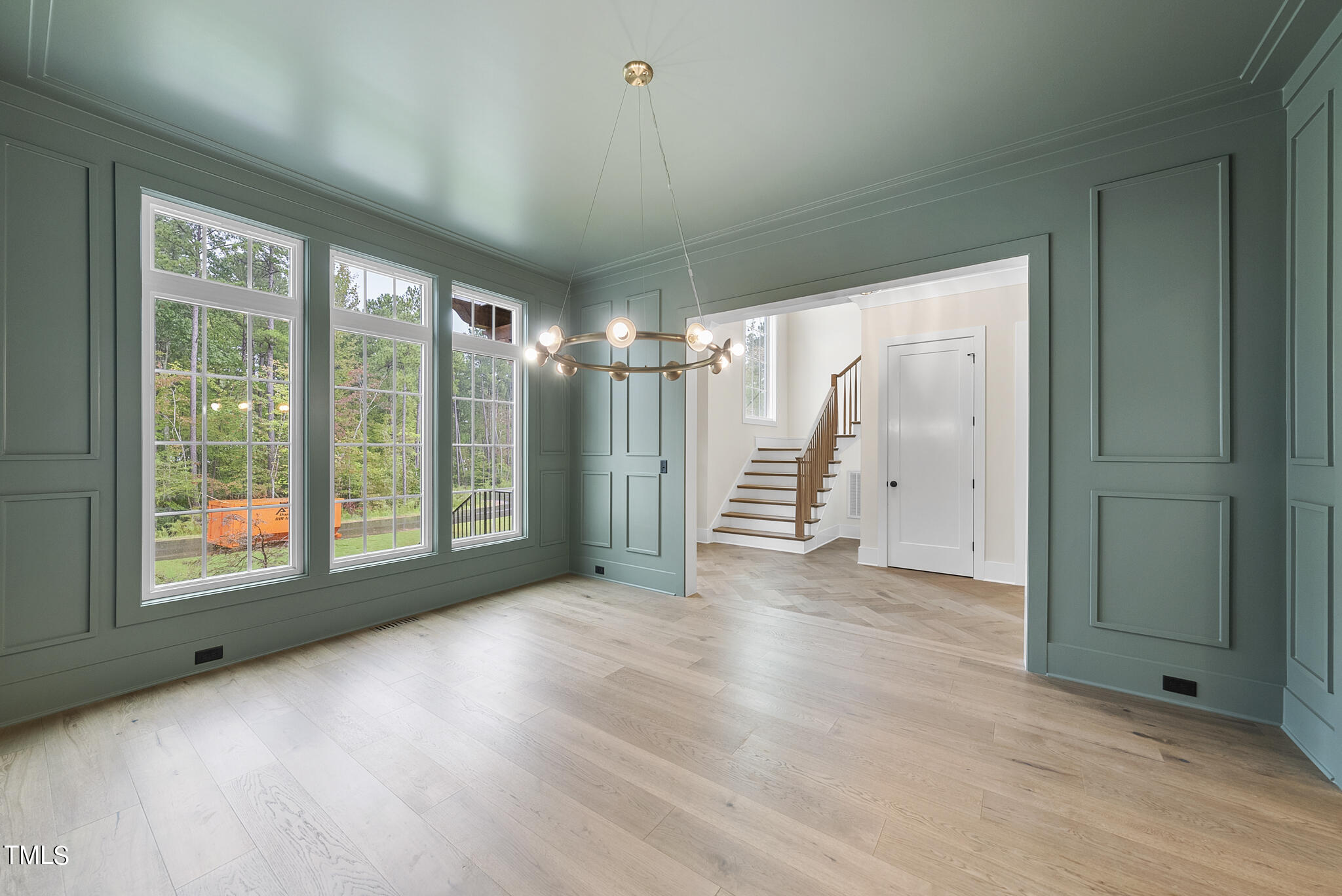 1409 Starry Night Court Raleigh, NC 27613 - Photo 6 of 35 a view of entryway with stairs and wooden floor