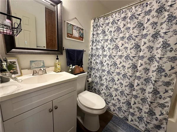 a bathroom with a toilet and a sink