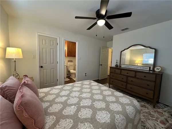 a bed room with a bed and a television