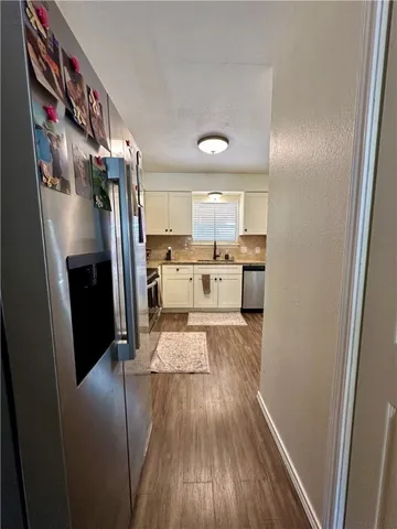 a view of a kitchen from the hallway