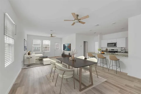 a view of a dining room with furniture window and wooden floor