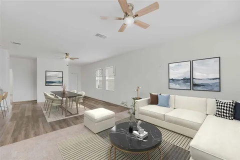 a living room with furniture and a table