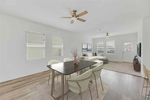 a dining room with furniture and window