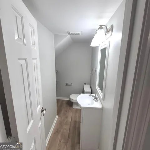 a kitchen with wooden cabinets and stainless steel appliances
