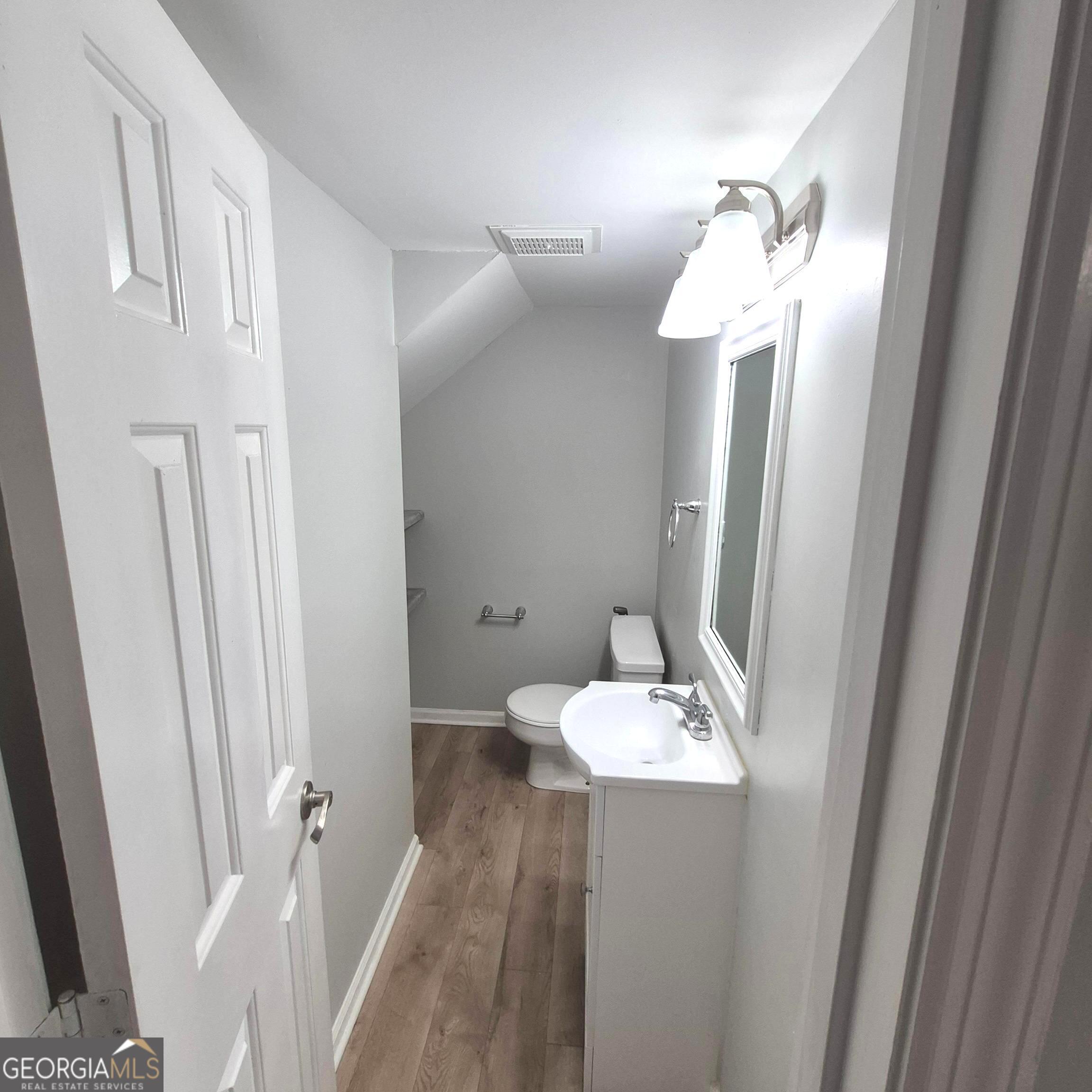 195 Springdale Court Macon, GA 31210 - Photo 6 of 14 a bathroom with a sink and mirror with toilet