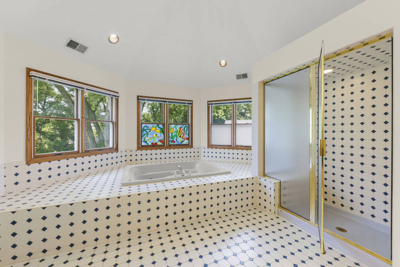 18040 Perth Avenue Homewood, IL 60430 - Photo 27 of 44 a bathroom with a black white checkered floor and a large window