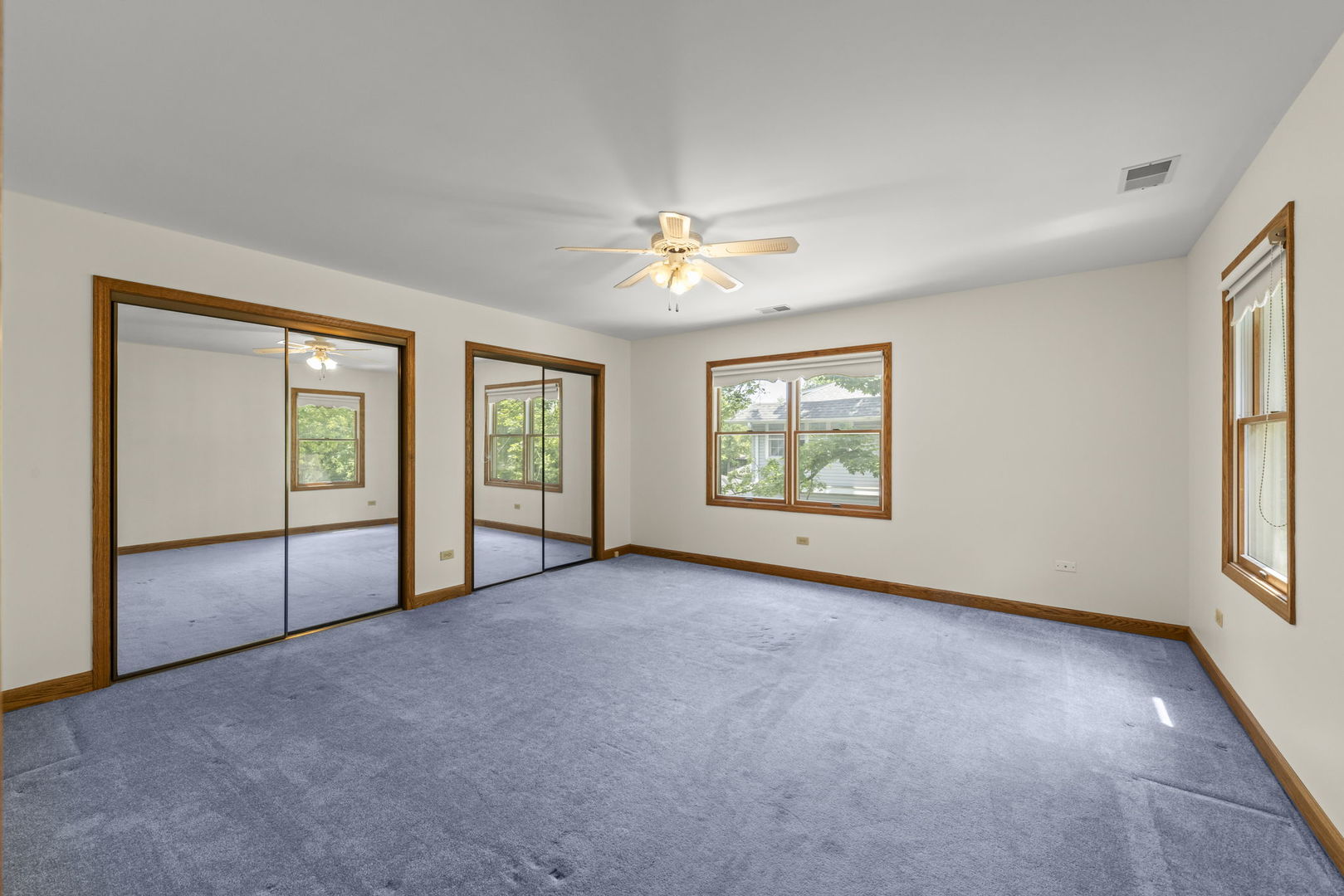 18040 Perth Avenue Homewood, IL 60430 - Photo 30 of 44 an empty room with chandelier fan and windows