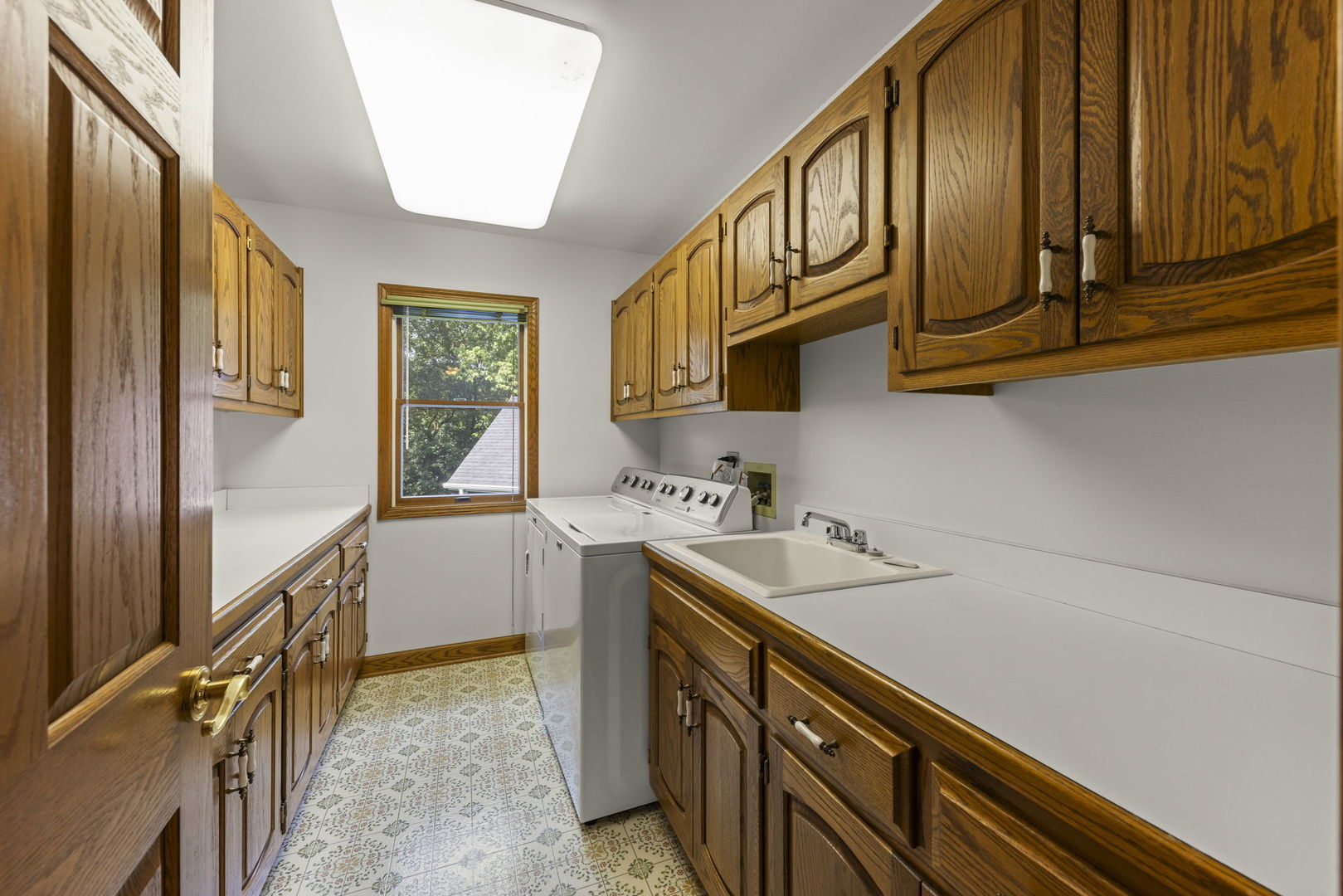18040 Perth Avenue Homewood, IL 60430 - Photo 32 of 44 a kitchen with cabinets a sink and appliances