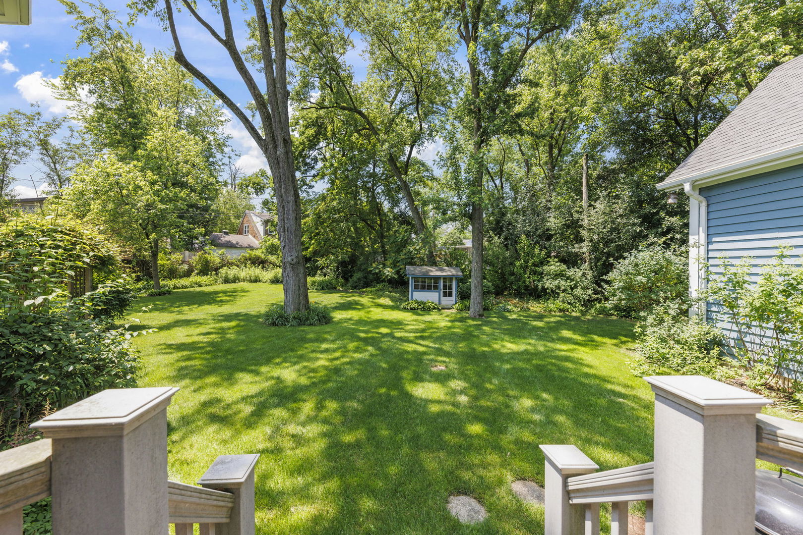 18040 Perth Avenue Homewood, IL 60430 - Photo 35 of 44 a backyard of a house with plants and large trees