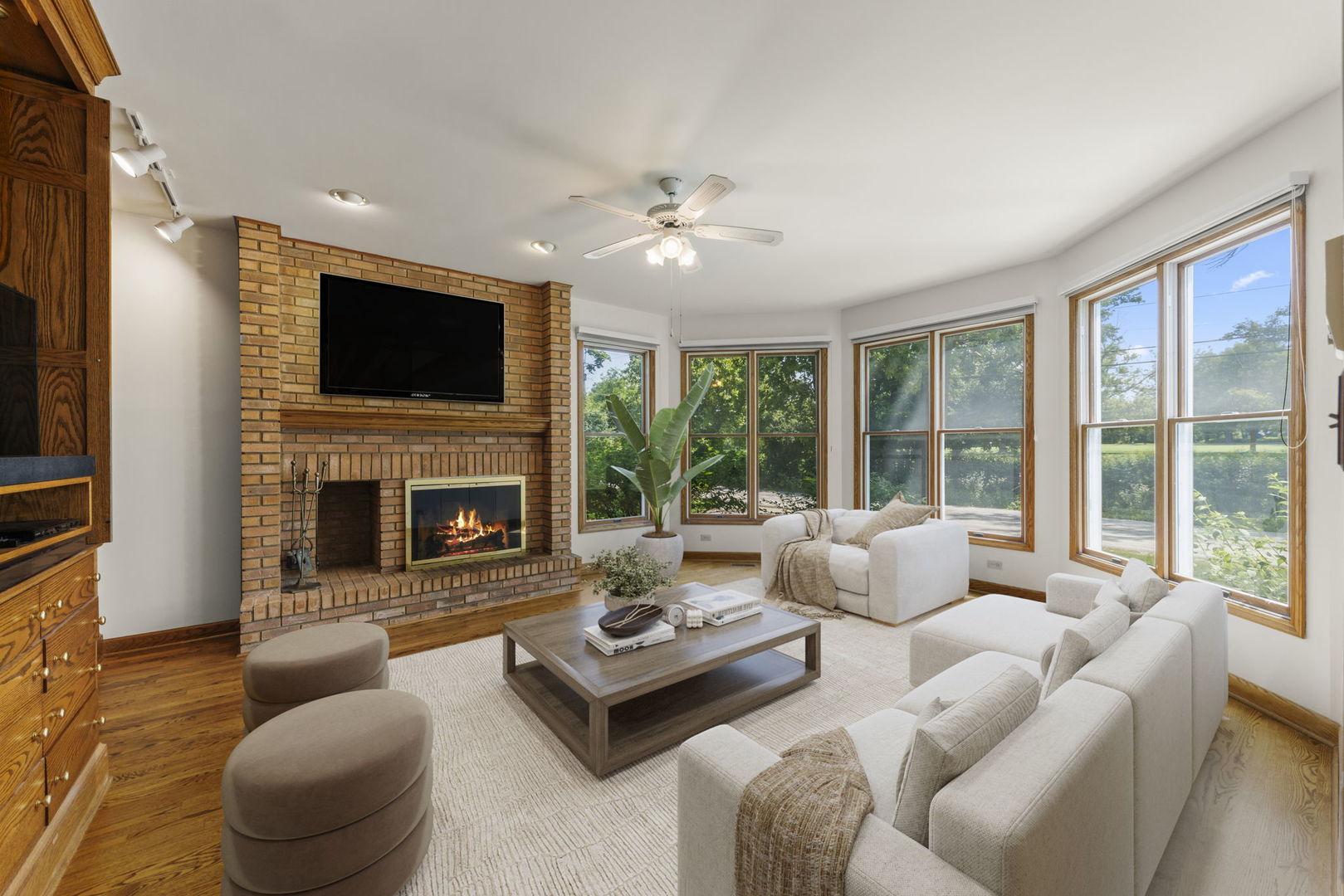 18040 Perth Avenue Homewood, IL 60430 - Photo 4 of 44 a living room with furniture a fireplace and a flat screen tv