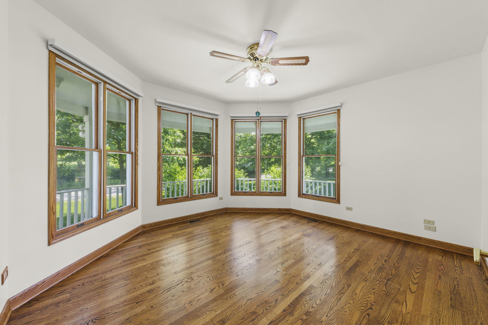 18040 Perth Avenue Homewood, IL 60430 - Photo 8 of 44 a view of an empty room with wooden floor and a window