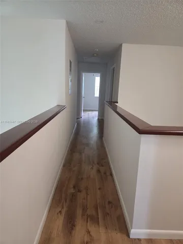 an empty room with a ceiling fan