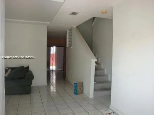 a view of entryway and workspace