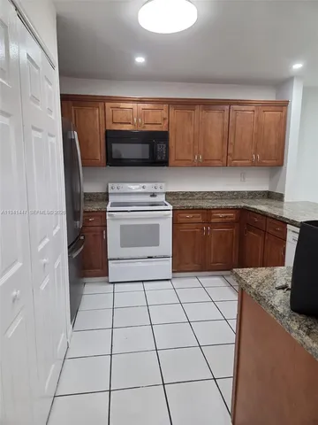 a view of a backyard of a house