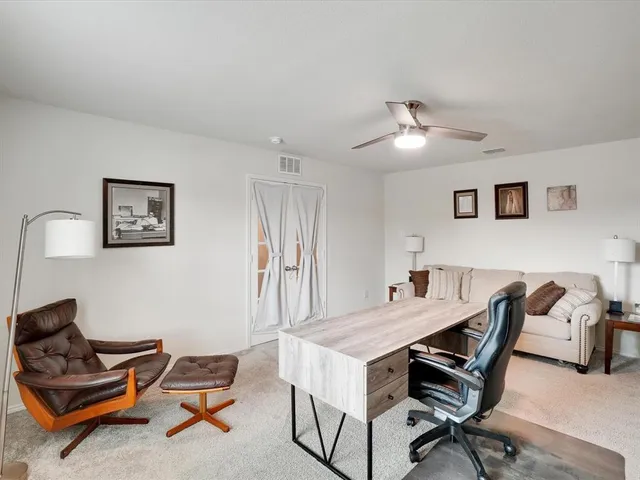 a view of a workspace with furniture