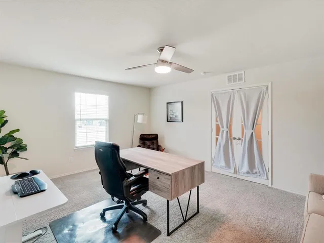 a workspace with furniture and a window