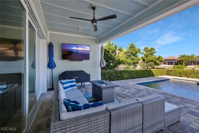 a view of swimming pool with outdoor space and seating