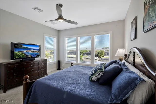 a bathroom with a granite countertop double vanity sink and a mirror
