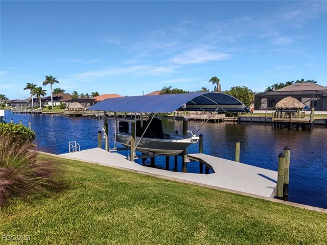 a view of a lake with a table and chairs