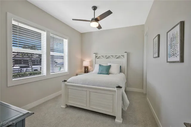 a bathroom with a granite countertop sink toilet a mirror and shower