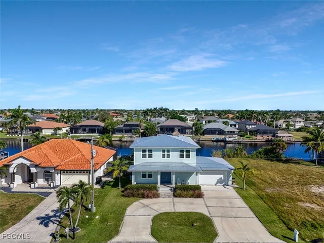 a view of a patio with chairs and a table