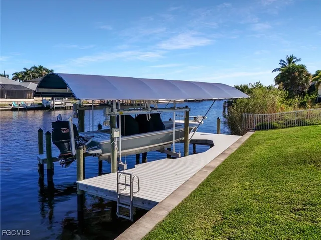 a swimming pool with outdoor seating and yard