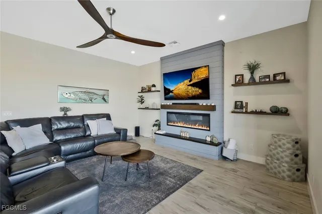 a living room with furniture and a flat screen tv