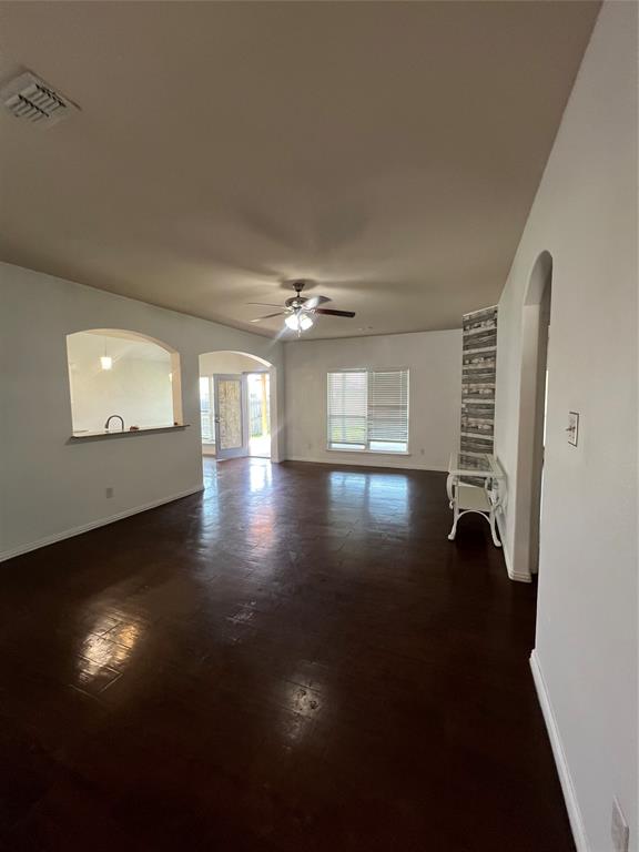 3144 Evangeline Road Fort Worth, TX 76140 - Photo 4 of 8 wooden floor in an empty room with a window