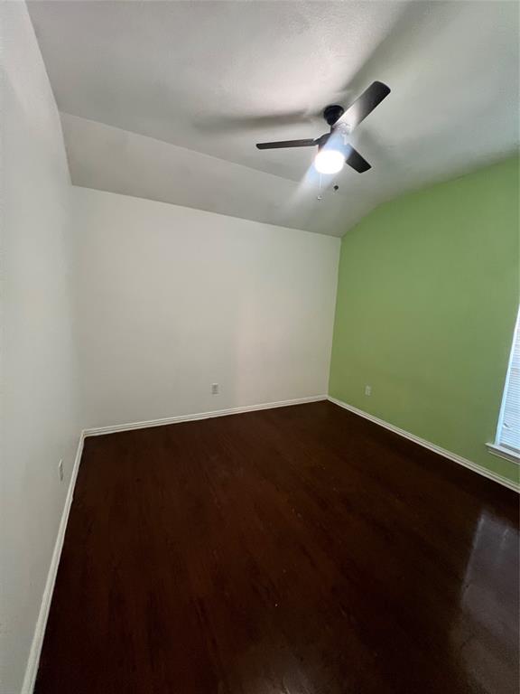 3144 Evangeline Road Fort Worth, TX 76140 - Photo 5 of 8 an empty room with wooden floor and fan
