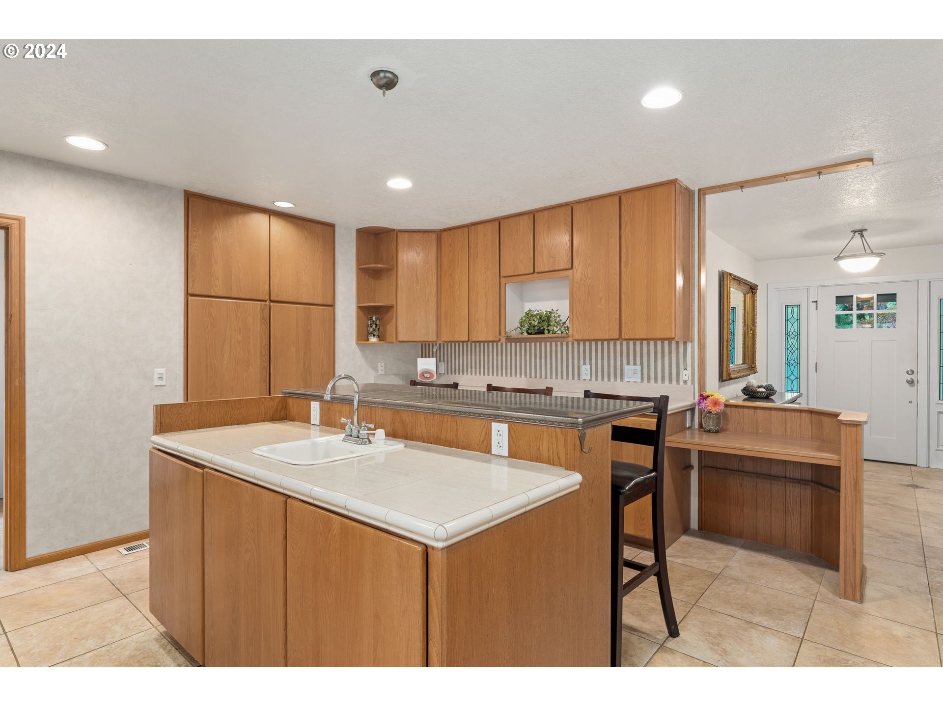 91070 Leashore Drive Vida, OR 97488 - Photo 12 of 43 a kitchen with a sink cabinets and wooden floor