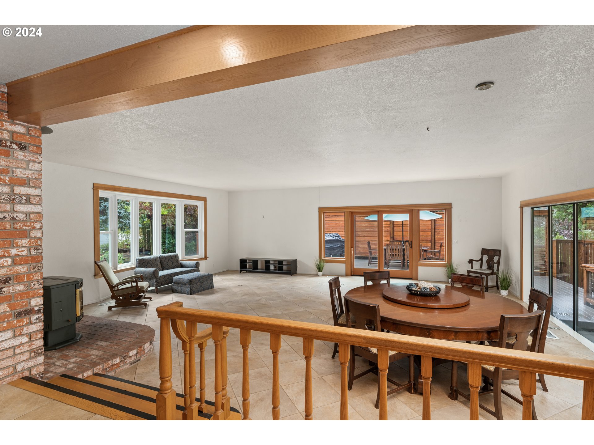 91070 Leashore Drive Vida, OR 97488 - Photo 13 of 43 a living room with furniture a flat screen tv and a large window