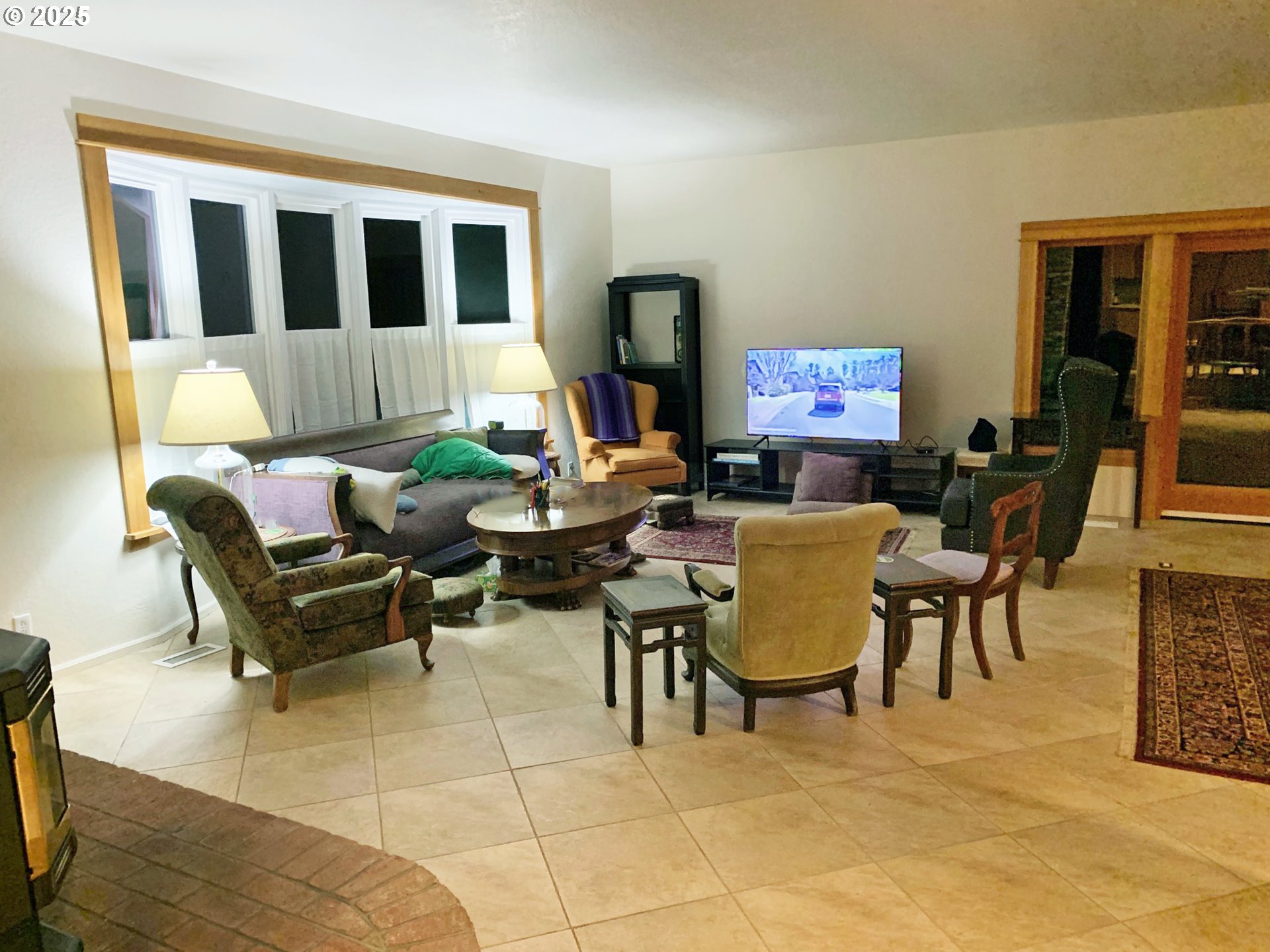 91070 Leashore Drive Vida, OR 97488 - Photo 14 of 43 a living room with furniture and a floor to ceiling window