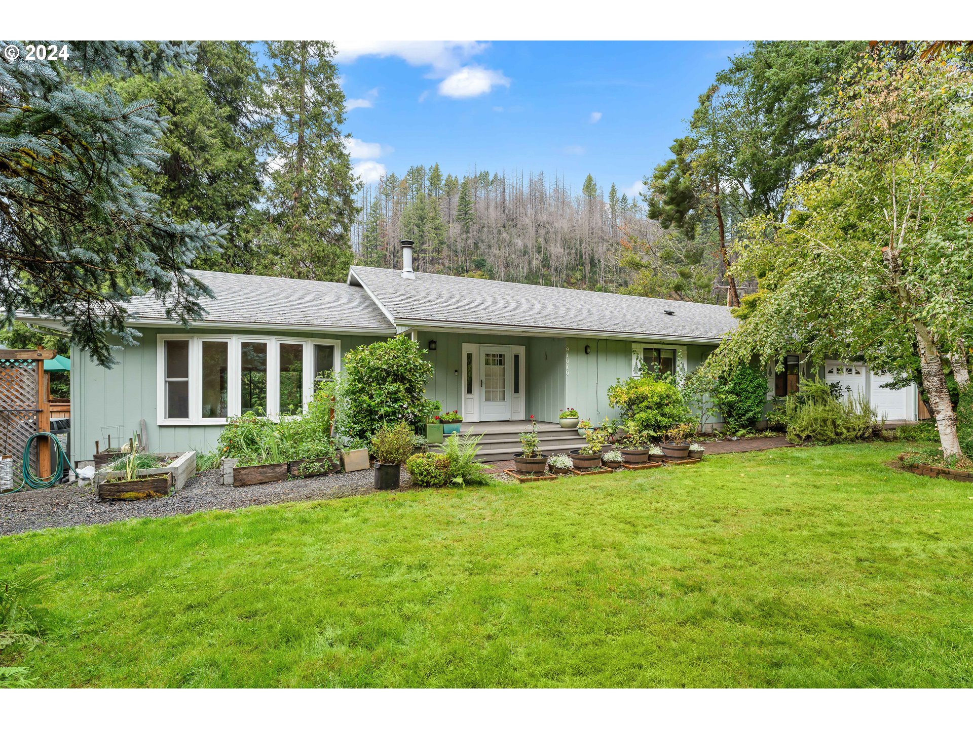 91070 Leashore Drive Vida, OR 97488 - Photo 2 of 43 a view of a house with a yard porch and sitting area