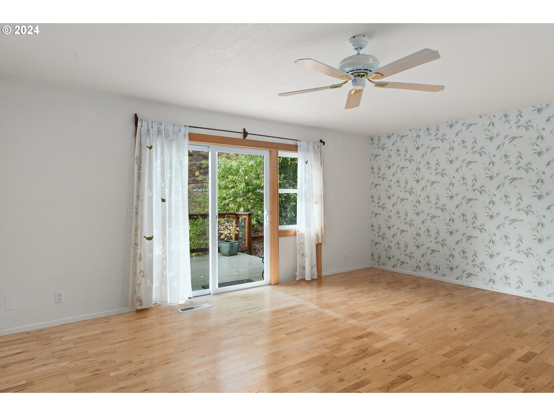 91070 Leashore Drive Vida, OR 97488 - Photo 32 of 43 a view of an empty room with a window