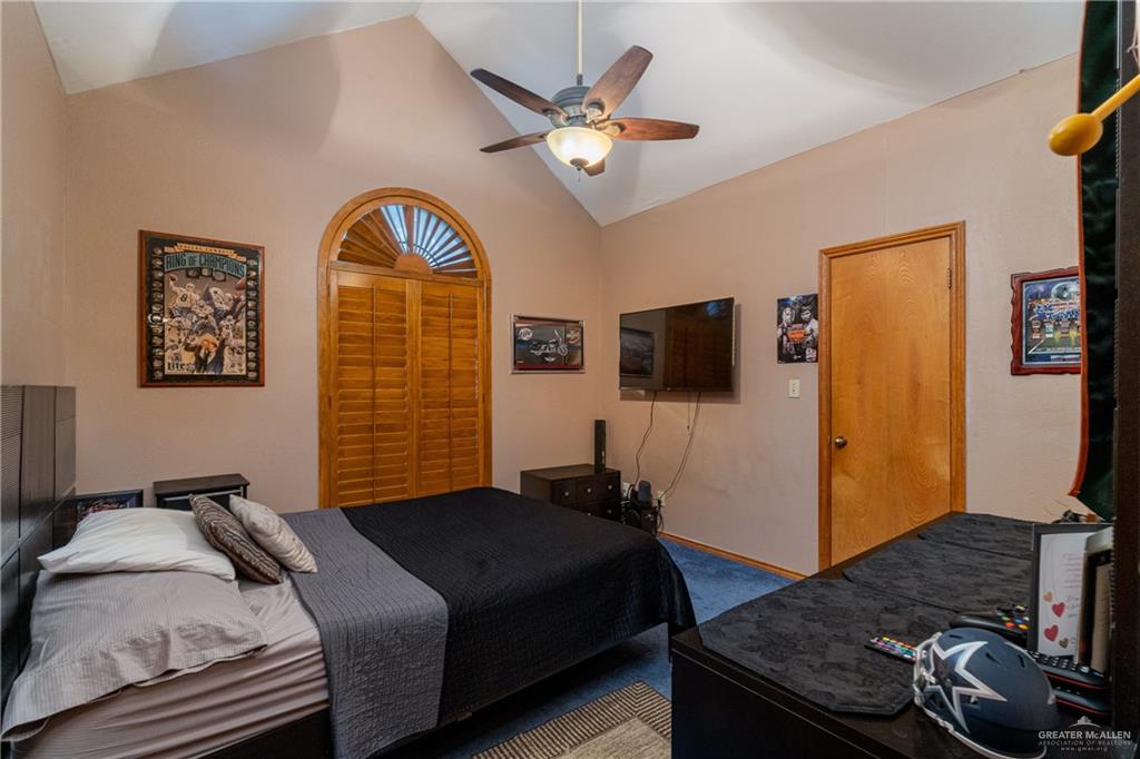 4112 Fm 493 Road Donna, TX 78537 - Photo 12 of 18 a bedroom with a bed and a flat screen television