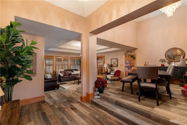 a view of a patio with table and chairs and potted plants