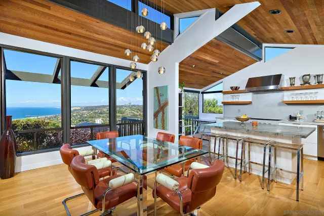 a kitchen with sink refrigerator and outdoor seating