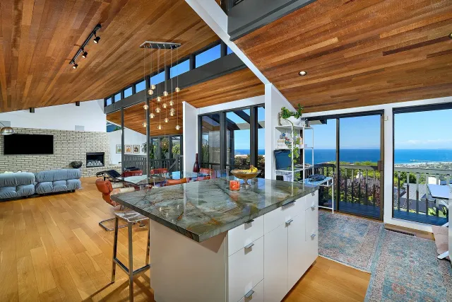 a kitchen with a sink a stove and cabinets