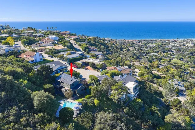 a view of a chairs and table in the backyard