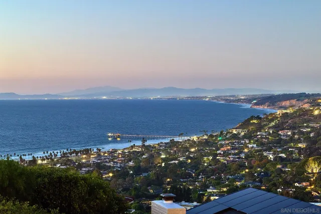 a outdoor living space with patio furniture and a flat screen tv