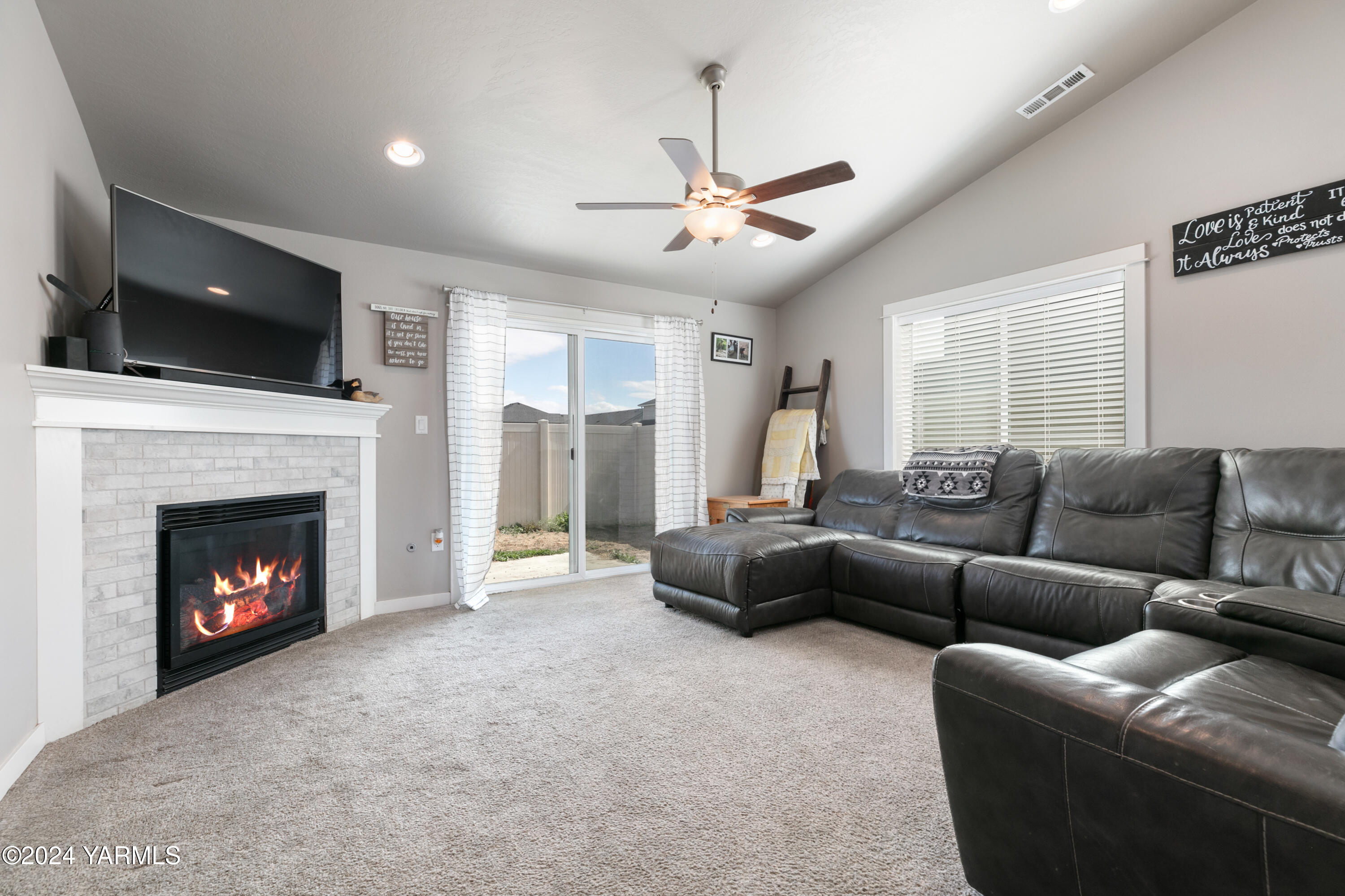 6210 Cottonwood Road Yakima, WA 98903 - Photo 4 of 18 a living room with furniture and a fireplace