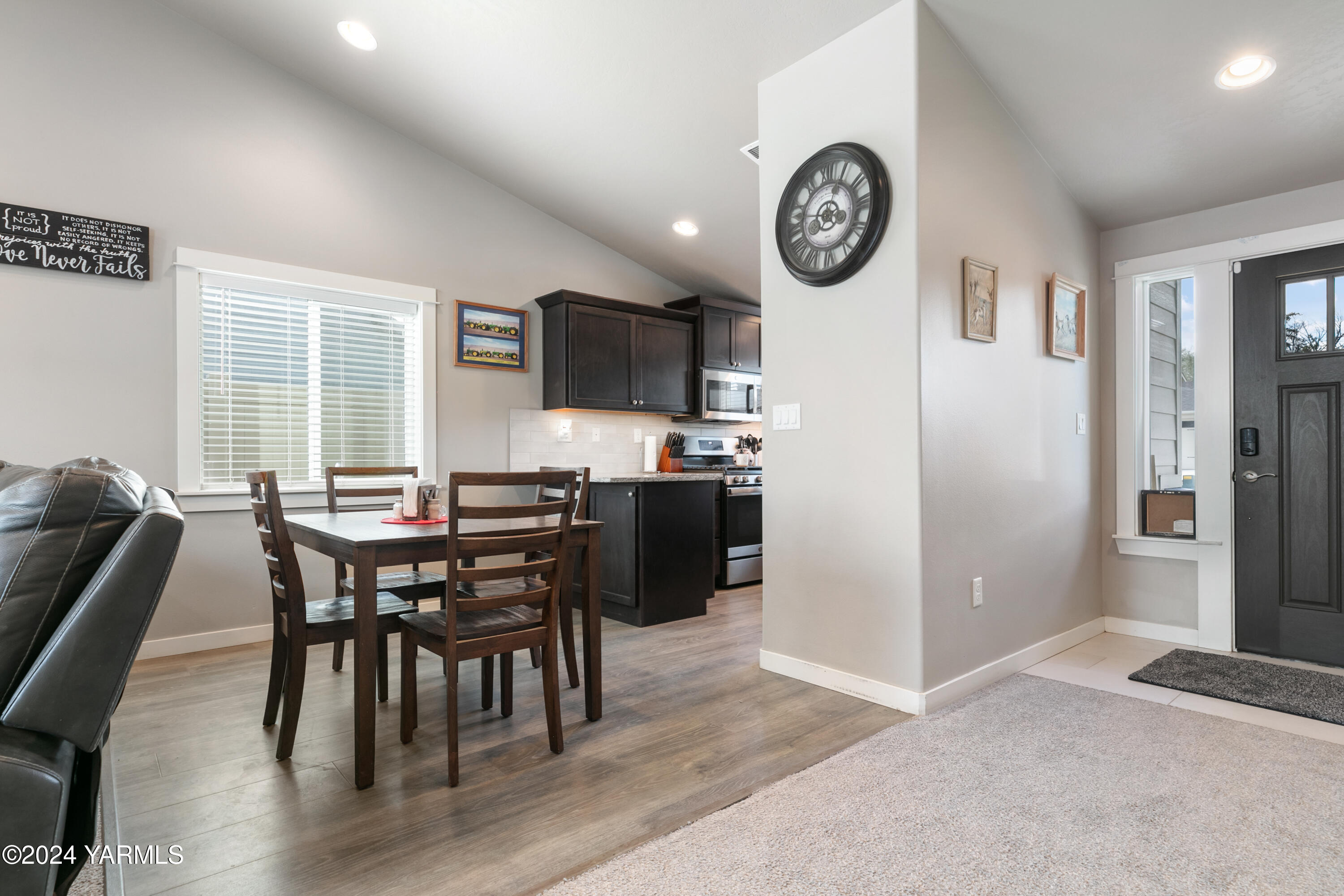6210 Cottonwood Road Yakima, WA 98903 - Photo 5 of 18 a view of a dining room with furniture window and wooden floor