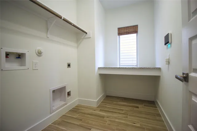 a view of a patio with a table and chairs
