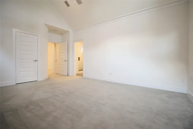 a view of an empty room and closet area