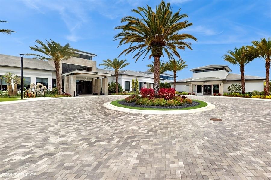 8350 Royal County Down Road Boca Raton, FL 33434 - Photo 37 of 52 a view of a white house with a swimming pool