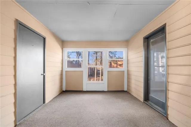 a view of an empty room and a window