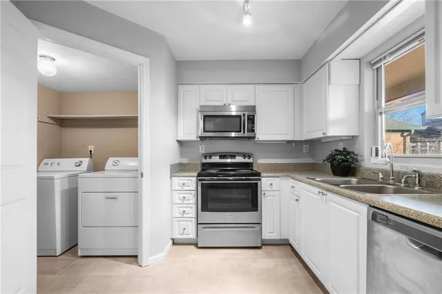 a kitchen with a stove and a microwave