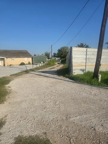a view of a house with a yard and garage